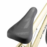 Close up of Mission Warsaw Combo seat on desert gold Kink Curb BMX bike