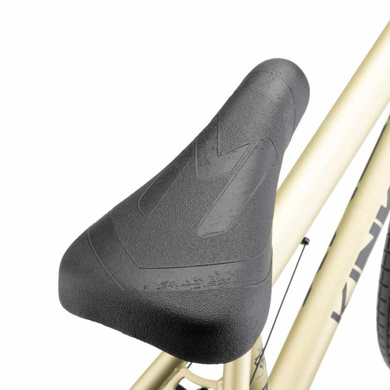 Close up of Mission Warsaw Combo seat on desert gold Kink Curb BMX bike