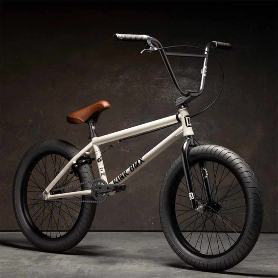 Kink Gap XL 20 inch BMX bike in Terrazzo White photographed at a 45 degree angle in an industrial warehouse