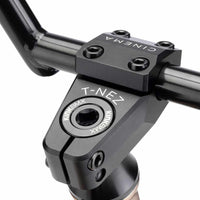 Close up of Cinema Martinez CNC top load stem built up on a mojave bronze Kink Williams BMX bike