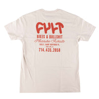 Beige t-shirt with red text on the back on a white background