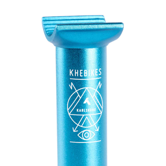 Close up photo of the KHE laser etched logo on the top of a KHE blue anodised pivotal seat post