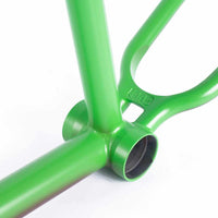 Close up of the bottom bracket and wishbone on the Cult Biggie AK frame in green on a white background