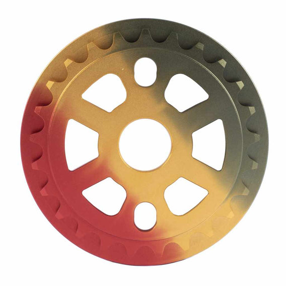 Rear view of Cult Dak Guard sprocket in anodised Rasta colourway on white background