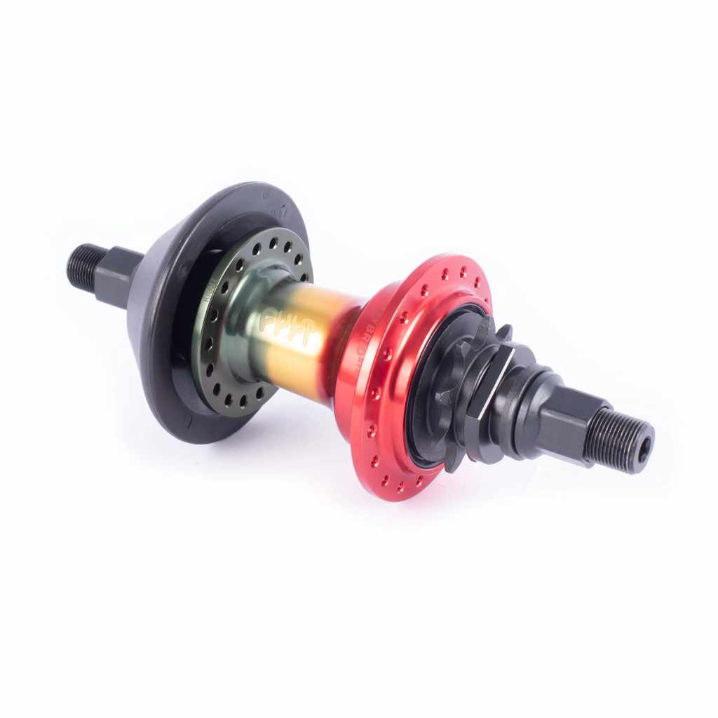 Angled view of Cult Hybrid LHD rear hub in Rasta colours on a white 