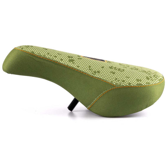 Green bicycle seat with textured pattern on a white background