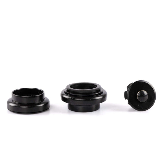 Three black cylindrical objects on a white background