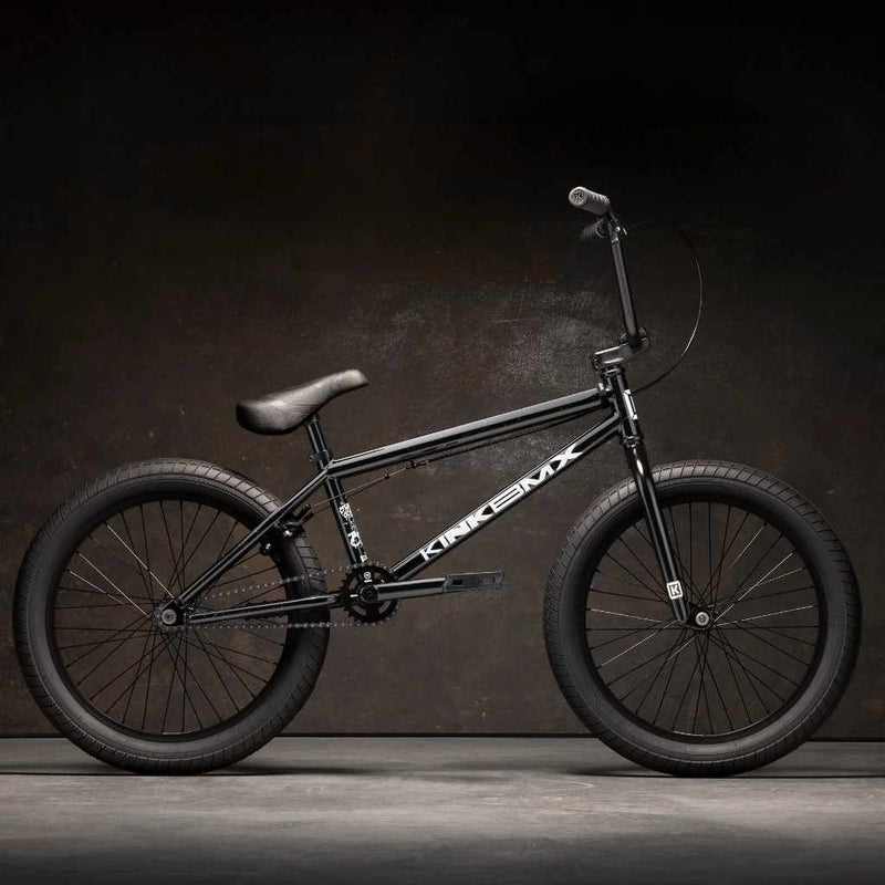Kink Curb 20 inch BMX bike in marble black photographed from the side in an industrial warehouse