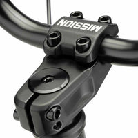 Close up of Mission Control top load stem built up on a marble black Kink Curb BMX bike