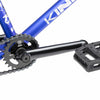 Close up of drive chain on Kink Curb BMX bike in cobalt blue, photo shows Mission Breach 25 tooth sprocket, Mission Triumph Chromoly 3 piece cranks and Kink Hemlock plastic pedal