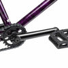 Close up of drive chain on Kink Downside BMX bike in hazy purple, photo shows Kink Imprint 25 tooth sprocket, Mission Triumph Chromoly 3 piece cranks and Kink Hemlock plastic pedal