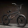 Kink Gap XL 20 inch BMX bike in midnight black photographed at a 45 degree angle in an industrial warehouse