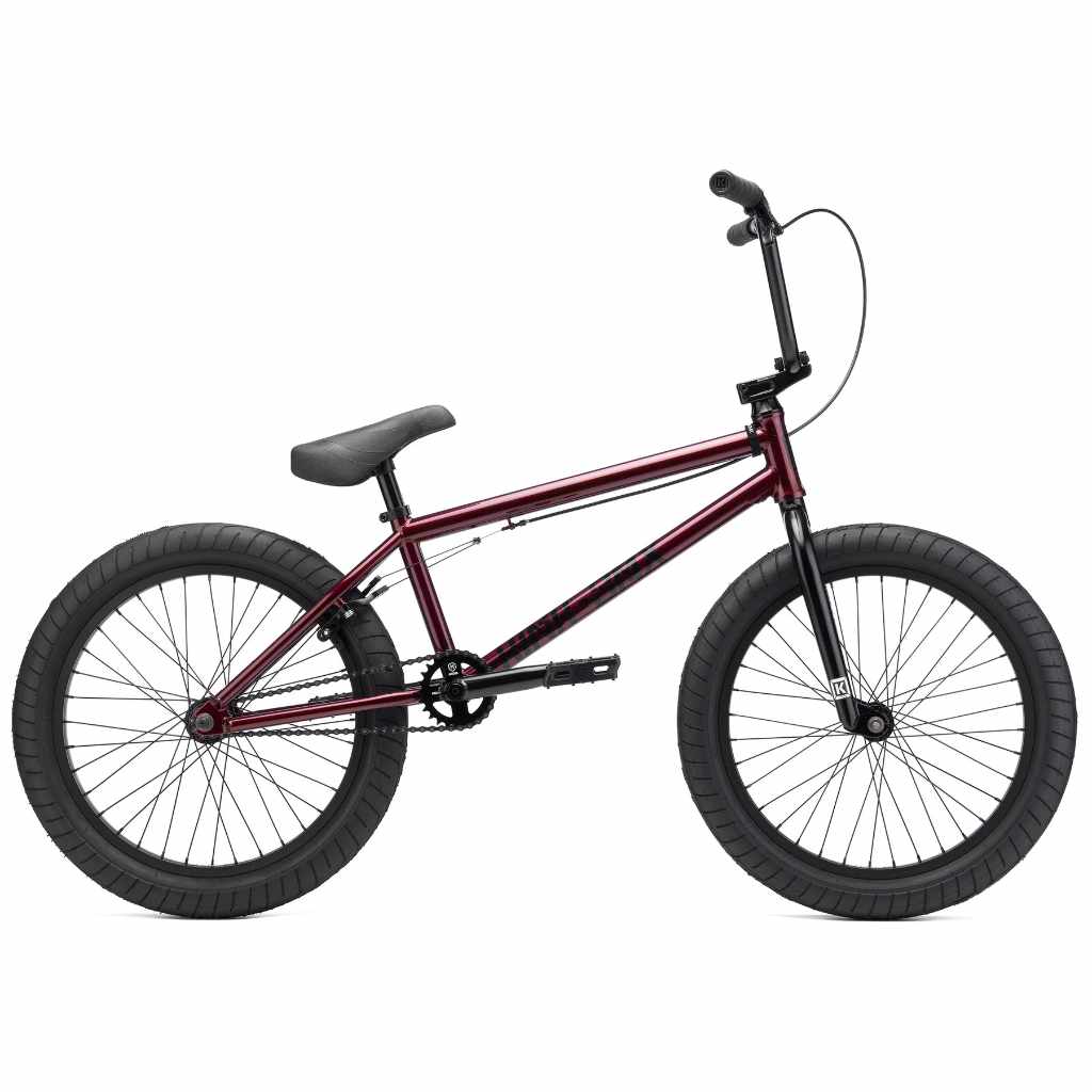 Side view of Kink Launch 20 inch BMX bike in plasma red photographed on a white background
