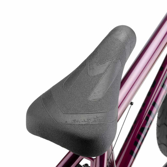 Close up of Mission Warsaw Combo seat on plasma red Kink Launch BMX bike