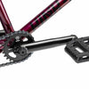 Close up of drive chain on Kink Launch BMX bike in plasma red, photo shows Mission Breach 25 tooth sprocket, Mission Triumph Chromoly 3 piece cranks and Kink Hemlock plastic pedal