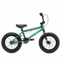 Kink Pump 14" BMX bike in Green side view, photographed on a white background