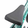 Close up photo of a black Mission Weider Combo seat assembled on to a Kink 2025 14" Pump BMX bike in Green