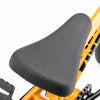 Close up photo of the Mission Wieder Combo seat fitted to a Kink Roaster 12 inch complete bike in orange