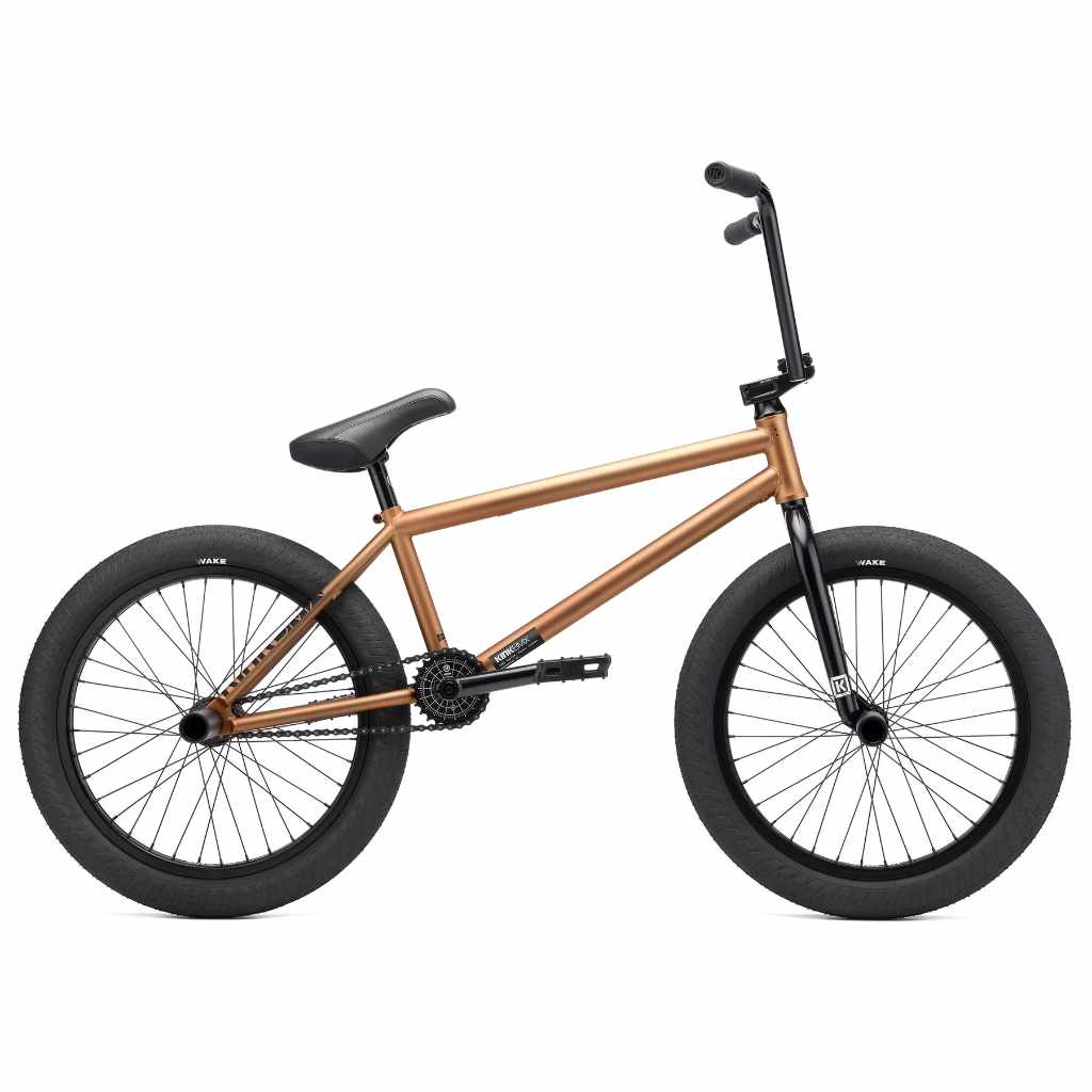 Side view of Kink Switch 20 inch BMX bike in astro red photographed on a white background
