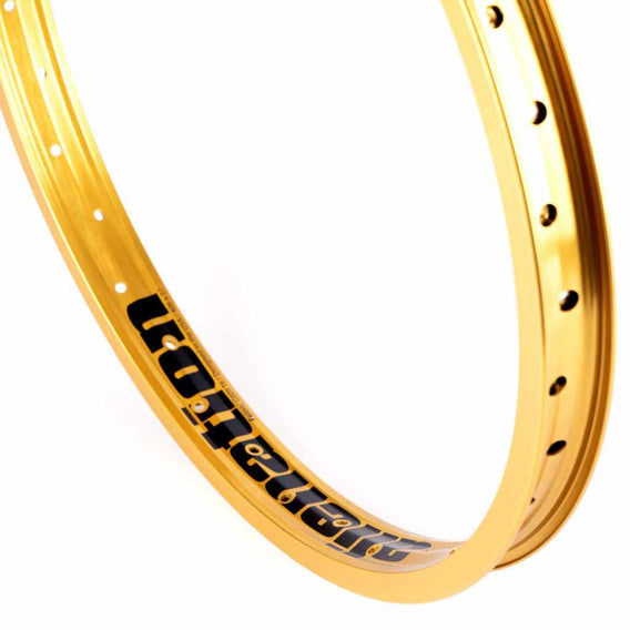 close up of Gold Alienation TCS Felon rim photographed on a white background