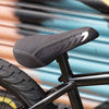 Close-up of a bicycle seat with a blurred background