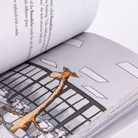 Open book with a detailed illustration of a giraffe and people on a bridge.