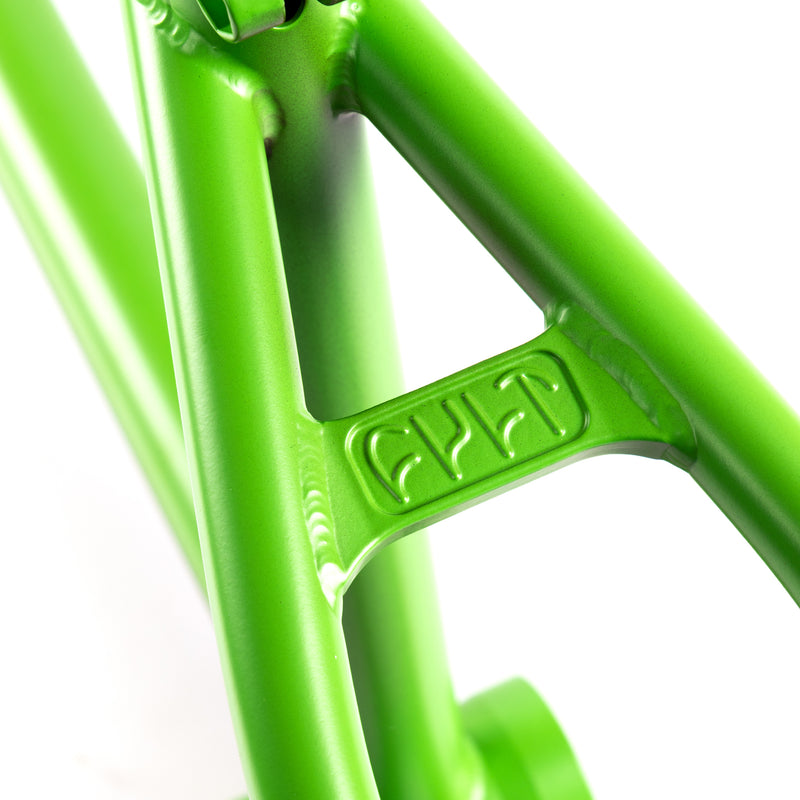 Close-up of a green cult AK BMX frame with cult brand logo on a white background