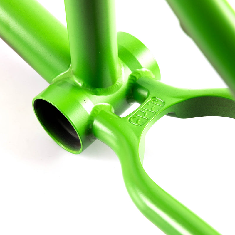 Close-up of a green CULT AK BMX frame bottom bracket shell and invest cast wishbone on a white background 