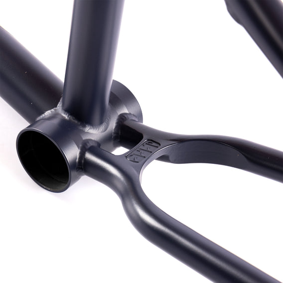 Close-up of a navy blue cult bmx frame wishbone on a white background