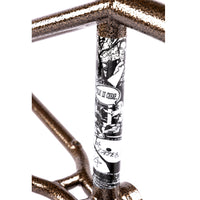 Close-up of a bicycle frame with a black and white graphic design on a white background