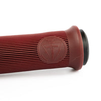 Close-up of a red grip with a logo on a white background