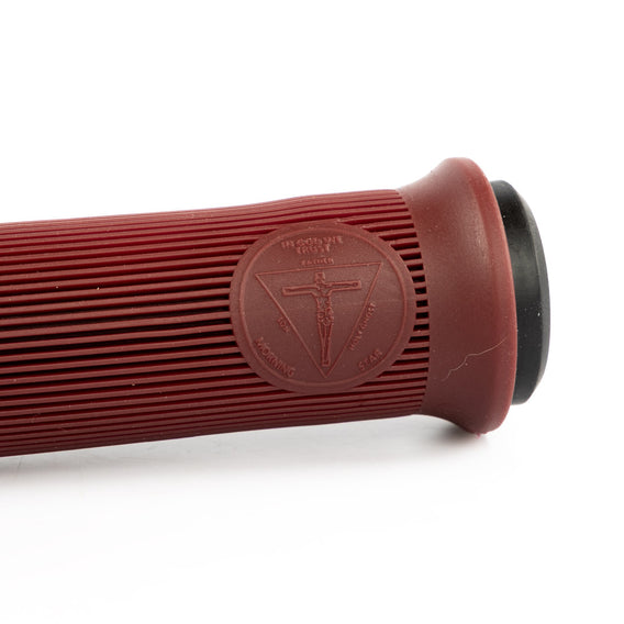Close-up of a red grip with a logo on a white background