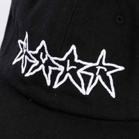 Black cap with white star designs on a plain background