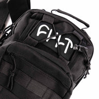 Black tactical bag with visible branding on a white background