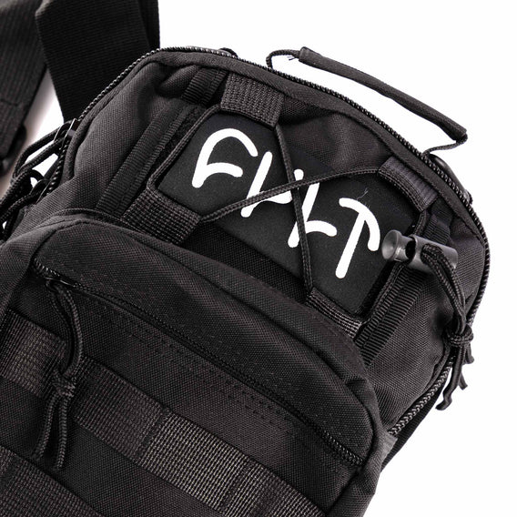 Black tactical bag with visible branding on a white background