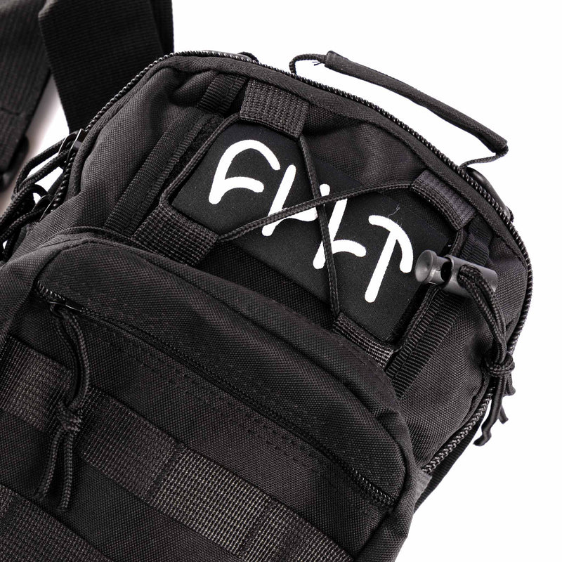 Black tactical bag with visible branding on a white background