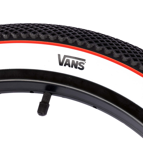 Cult Vans tyre Black with white sidewall and red stripe 2.35" logo close up