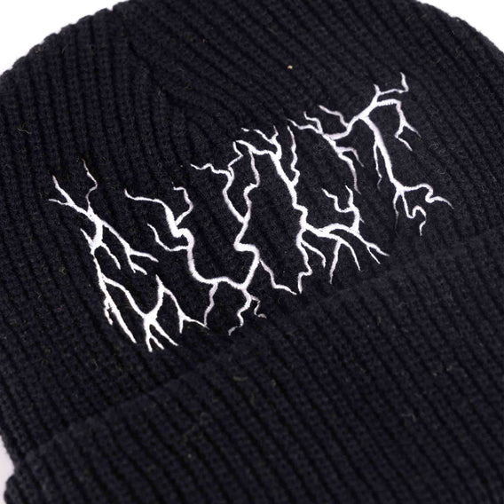 Close up of the embroidered logo on the embroidered Cult Metal logo on a black beanie