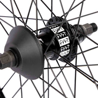 Close-up of a bicycle hub with visible branding on a white background