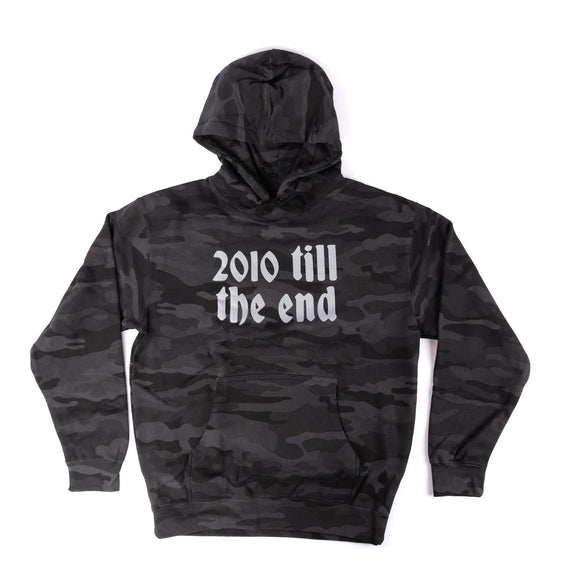 Black camouflage hoodie with '2010 till the end' text on a white background