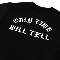 Black t-shirt with white text 'ONLY TIME WILL TELL' on a plain background
