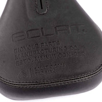 Close-up of a bicycle seat with 'Eclat' branding on a white background