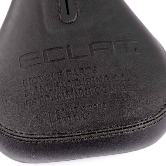 Close-up of a bicycle seat with 'Eclat' branding on a white background