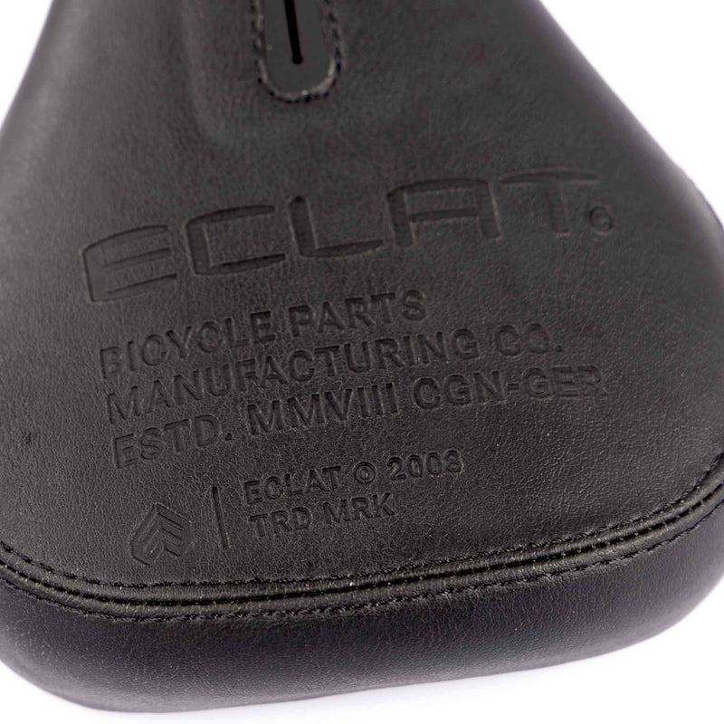 Close-up of a bicycle seat with 'Eclat' branding on a white background