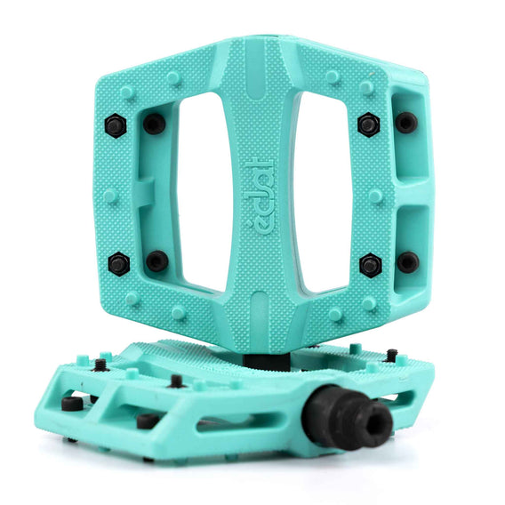 Turquoise Teal Eclat Contra BMX pedal with black pins on a white background