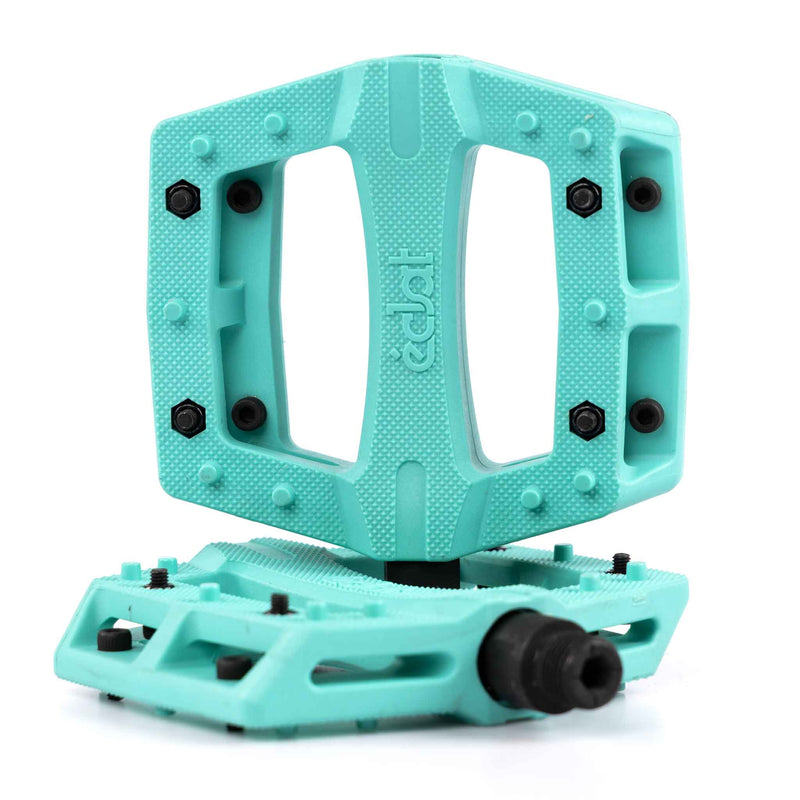Turquoise Teal Eclat Contra BMX pedal with black pins on a white background