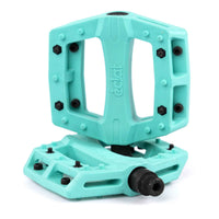 Turquoise Teal Eclat Contra BMX pedal with black pins on a white background