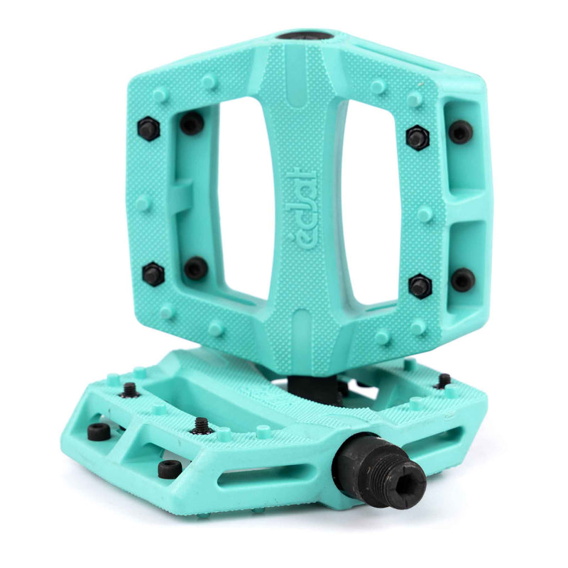 Turquoise Teal Eclat Contra BMX pedal with black pins on a white background