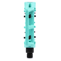 Turquoise Teal Eclat Contra BMX pedal with black pins on a white background