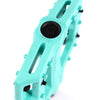 Turquoise Teal Eclat Contra BMX pedal with black pins on a white background